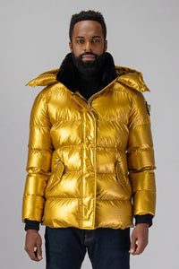 High-end Canadian designer winter coat for men in "Gold" colour. Woodpecker cruelty-free winter coat designed in Canada. Men's heavy weight medium length premium designer jacket for winter. Superior quality warm winter coat for men. Moose Knuckles, Canada Goose, Mackage, Montcler, Will Poho, Willbird, Nic Bayley. Shiny parka. Stylish winter jacket. Designer winter coat.