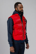 Load image into Gallery viewer, Woodpecker Unisex Winter Vest. High-end Canadian designer winter vest in &quot;Fashion Santa&quot; red colour. Woodpecker cruelty-free vest designed in Canada. Heavy weight short length premium designer vest for winter. Superior quality warm winter vest. Moose Knuckles, Canada Goose, Mackage, Montcler, Will Poho, Willbird, Nic Bayley. Extra warm. Shiny vest. Stylish winter vest. Designer winter vest.
