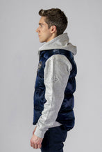 Load image into Gallery viewer, Woodpecker Unisex Winter Vest. High-end Canadian designer winter vest in &quot;All Wet Navy&quot; colour. Woodpecker cruelty-free vest designed in Canada. Heavy weight short length premium designer vest for winter. Superior quality warm winter vest. Moose Knuckles, Canada Goose, Mackage, Montcler, Will Poho, Willbird, Nic Bayley. Extra warm. Shiny vest. Stylish winter vest. Designer winter vest.
