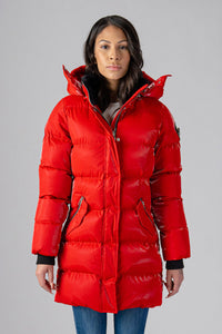 Woodpecker Women's Penguin Long Winter coat. High-end Canadian designer winter coat for women in "All Wet Red" colour. Woodpecker cruelty-free winter coat designed in Canada. Women's heavy weight long length premium designer jacket for winter. Superior quality warm winter coat for women. Moose Knuckles, Canada Goose, Mackage, Montcler, Will Poho, Willbird, Nic Bayley. Extra warm. Shiny parka. Stylish winter jacket. Designer winter coat.