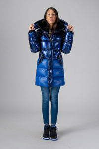Woodpecker Women's Penguin Long Winter coat. High-end Canadian designer winter coat for women in "Oily Blue Blue" colour. Woodpecker cruelty-free winter coat designed in Canada. Women's heavy weight long length premium designer jacket for winter. Superior quality warm winter coat for women. Moose Knuckles, Canada Goose, Mackage, Montcler, Will Poho, Willbird, Nic Bayley. Extra warm. Shiny parka. Stylish winter jacket. Designer winter coat.