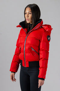 Woodpecker Women's Woody Bomber Winter coat. High-end Canadian designer winter coat for women in shiny “All Wet Red". Woodpecker cruelty-free winter coat designed in Canada. Women's heavy weight short length premium designer jacket for winter. Superior quality warm winter coat for women. Moose Knuckles, Canada Goose, Mackage, Montcler, Will Poho, Willbird, Nic Bayley. Shiny parka. Stylish winter jacket. Designer winter coat.