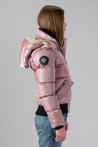 Woodpecker Women's Woody Bomber Winter coat. High-end Canadian designer winter coat for women in “Arctic Rose" colour. Woodpecker cruelty-free winter coat designed in Canada. Women's heavy weight short length premium designer jacket for winter. Superior quality warm winter coat for women. Moose Knuckles, Canada Goose, Mackage, Montcler, Will Poho, Willbird, Nic Bayley. Shiny parka. Stylish winter jacket. Designer winter coat.