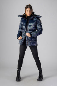 Woodpecker Women's Bumnester Winter coat. High-end Canadian designer winter coat for women in "Oily Blue" colour. Woodpecker cruelty-free winter coat designed in Canada. Women's heavy weight medium length premium designer jacket for winter. Superior quality warm winter coat for women. Moose Knuckles, Canada Goose, Mackage, Montcler, Will Poho, Willbird, Nic Bayley. Extra warm. Shiny parka. Stylish winter jacket. Designer winter coat.
