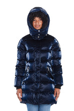 Load image into Gallery viewer, High-end Canadian designer winter coat for women in shiny &quot;all-wet&quot; navy blue colour. Woodpecker vegan winter coat designed in Canada. Women&#39;s heavy weight long length premium designer jacket for winter. Superior quality warm winter coat for women.
