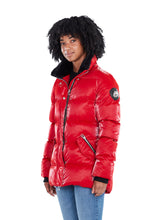 Load image into Gallery viewer, High-end Canadian designer winter coat for women in shiny &quot;all-wet&quot; red colour. Woodpecker vegan winter coat designed in Canada. Women&#39;s heavy weight medium length premium designer jacket for winter. Superior quality warm winter coat for women.
