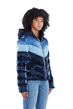 Load image into Gallery viewer, High-end Canadian designer winter coat for women in shiny &quot;blue steel&quot; three-tone blue colour. Woodpecker vegan winter coat designed in Canada. Women&#39;s medium weight long length premium designer jacket for winter. Superior quality warm winter coat for women.
